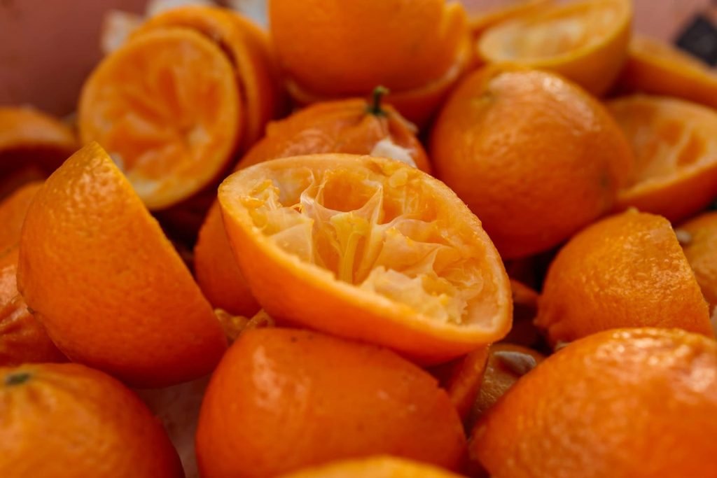 Oranges recenlty squeezed that showcase what is a cold press juicer